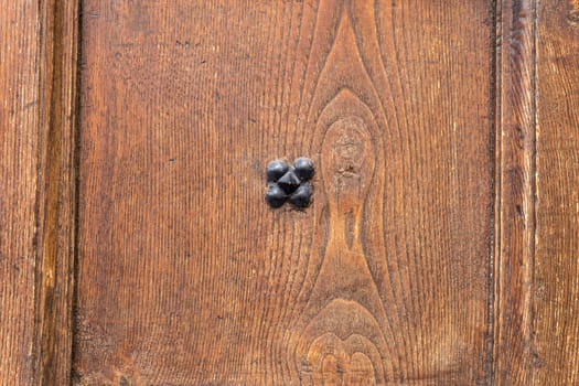 Close up of rustic old door in Spoleto, Italy.