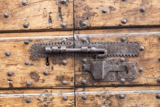 Close up of rustic old door in Spoleto, Italy.