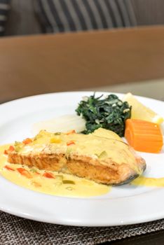 Frilled Salmon Steak with spinach and mustard sauce