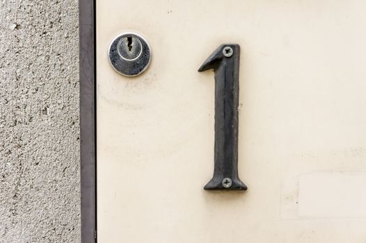 house number one (1) next to a lock