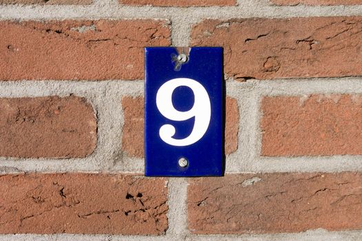 House number  nine (9)