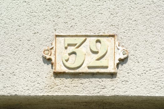 Cast iron house number thirty two (32)