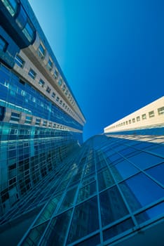 Modern building exterior low angle view with blue sky