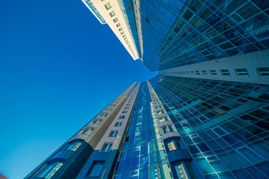 Modern building exterior low angle view with blue sky