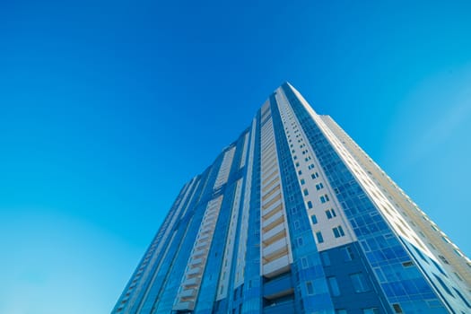 Modern building exterior low angle view with blue sky