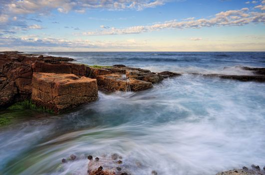 Intertidal movements around rocks  in early morning light.  Port Stephens coastline