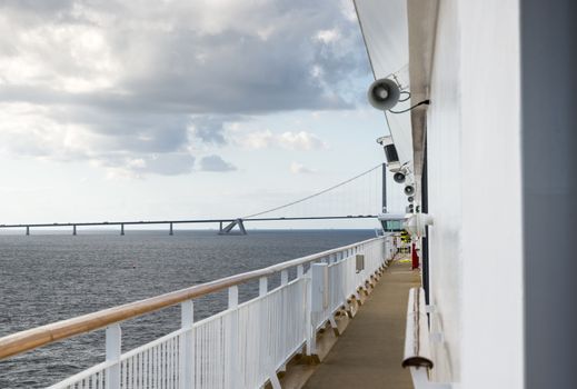 cruise ship crossing the great belt bridge at denmark at the danish islands
