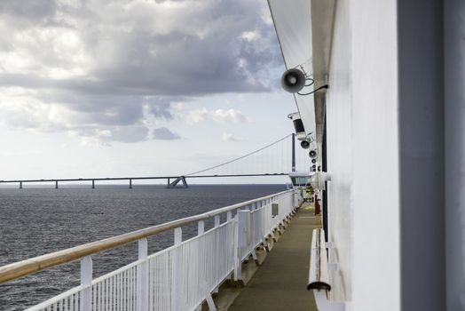 cruise ship crossing the great belt bridge at denmark at the danish islands