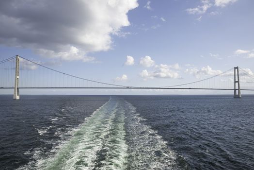 crossing the Suspension bridge Great Belt Denmark connecting the Zealand and Funen with a boat