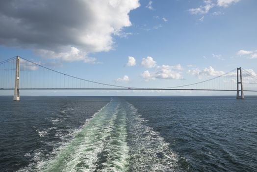 crossing the Suspension bridge Great Belt Denmark connecting the Zealand and Funen with a boat