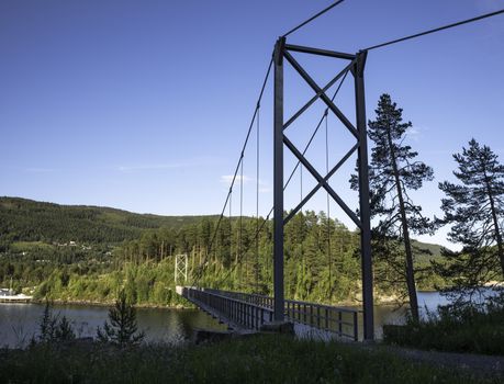 bridge over Leira fjord in norway with blue sky background