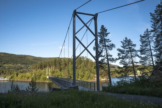 bridge over Leira fjord in norway with blue sky background