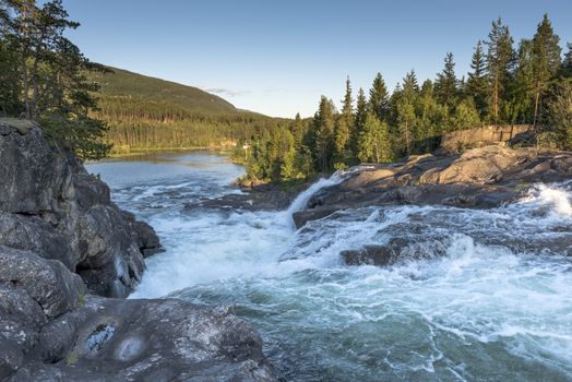 waterfall in norway near the jotunheimen national park in the villag Leira