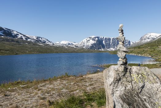 The famous road in Norway also called road 51 or the bygdin vegen near Bismo with stack of stones