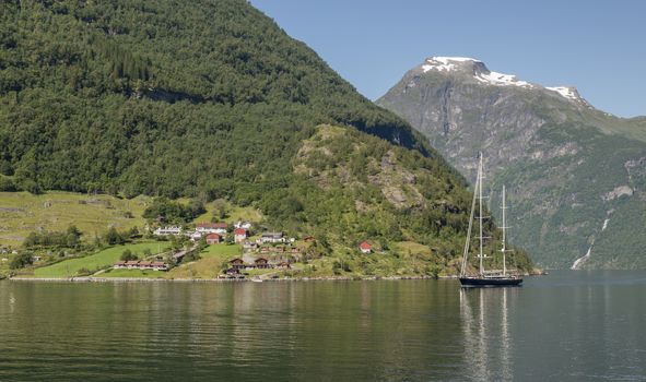 cruise on the geiranger fjord with sailingship and the high mountains as background