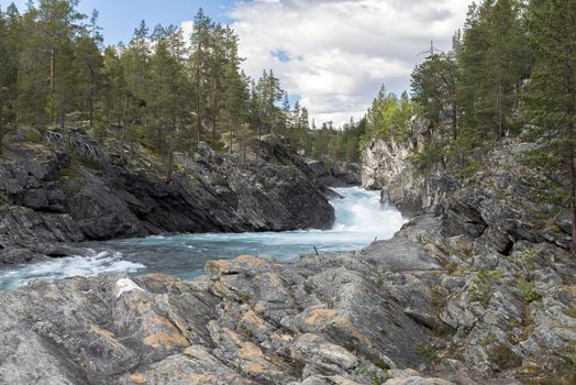 waterfall and rocks in norway near geiranger otta river