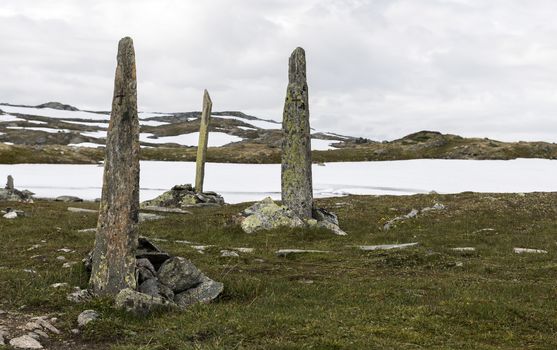 piles of stones as a monument on road 55 where man with horses died by freezing dead when crossing this moutains in 1862