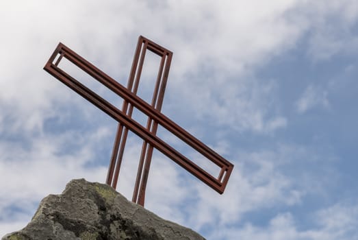 religion cross as monument on a rock in norway