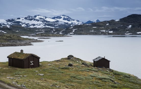wooden houses at the famous County Road 55. Highest mountain road in Norway, part of National Tourist Route