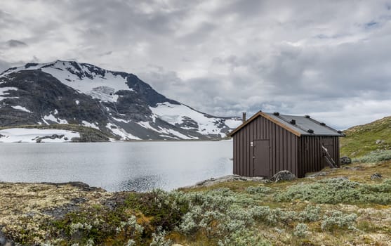 wooden house or hut at the famous County Road 55. Highest mountain road in Norway, part of National Tourist Route