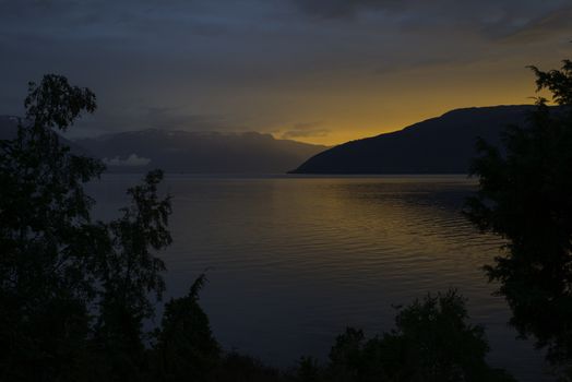 sunset at the sognefjord in norway near the place called Vik
