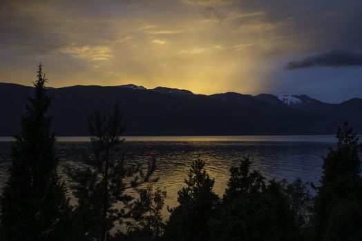sunset at the sognefjord in norway near the place called Vik