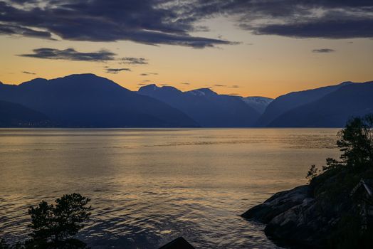 sunset at the sognefjord in norway near the place called Vik