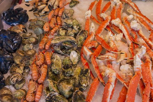Various seafood on the shelves of the fish market in Norway, Bergen
