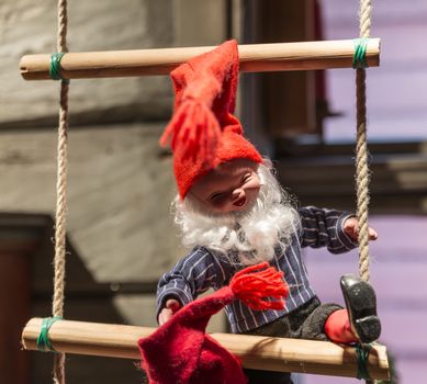 santa claus puppet with big smile on rope ladder