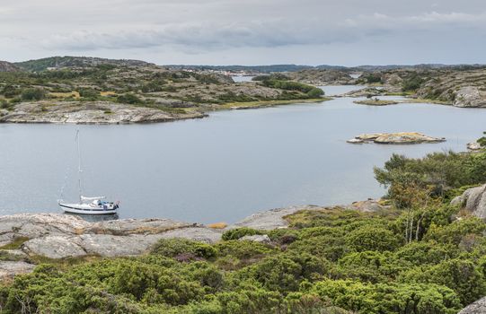 coastline in sweden above fjallbacka with boats and sea as background