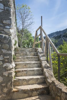 old monumental staircase near the castle of zuheros with wooden fence