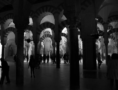 black and white of tourists explore at Madinat al-Zahra in Cordoba on 04 april 2017, the median , Spain, the Medina houses a catherdral insite the big mosque 