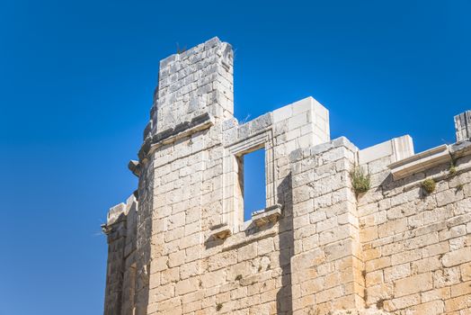 old stone wall with blus sky as background