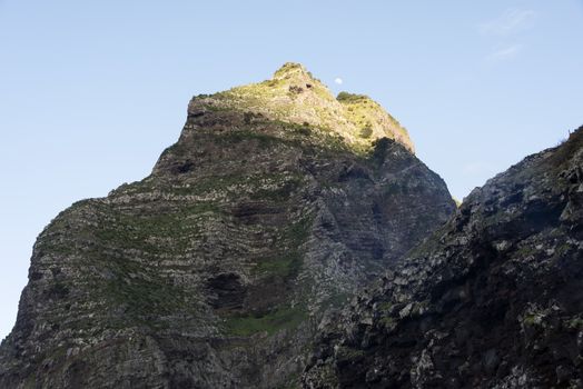 mounatain peakes on Madeira with blue sky and moon as background