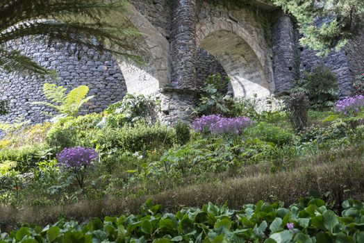 flower garden in Monte Madeira with old bridge
