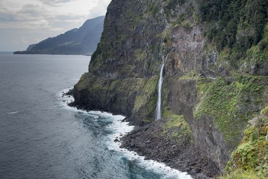 Wild atlantic coast, Island Madeira coastline - impressiv mountain with waterfall - Ponta do Poiso