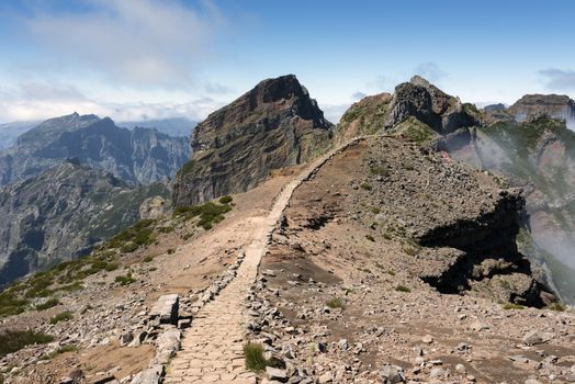 View down over the clouds from slopes of Pico do Arieiro,Madeira 1818 meters high rocks