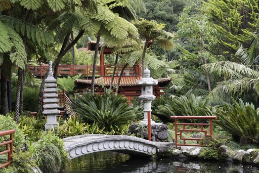 botanical public gardens in Funchal Madeira with the japanese part with red bridges and ornaments