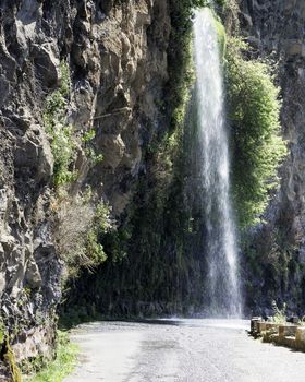 waterfall in nature on portuguese island of madeira road near calheta