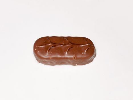 brown chocolate bounty bar on white surface sweets food; essex; england; uk