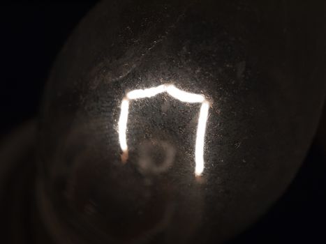 close up of bright white light bulb filament macro; essex; england; uk