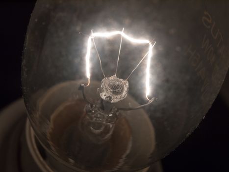 close up of bright white light bulb filament macro; essex; england; uk