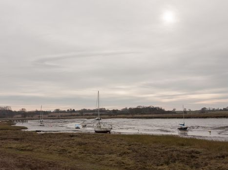 autumn winter dark cloudy overcast harbour scene estuary; essex; england; uk