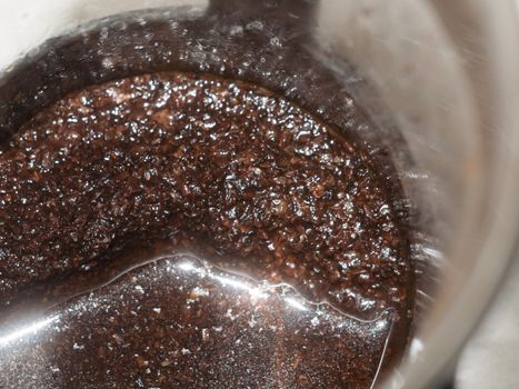close up of wet coffee grounds in press background texture macro cafe; essex; england; uk