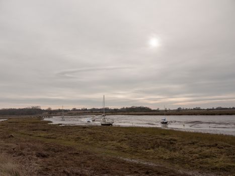 autumn winter dark cloudy overcast harbour scene estuary; essex; england; uk