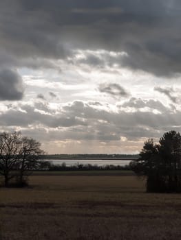 moody skyline clouds over autumn farm field ; essex; england; uk