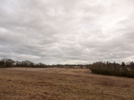 moody skyline clouds over autumn farm field ; essex; england; uk