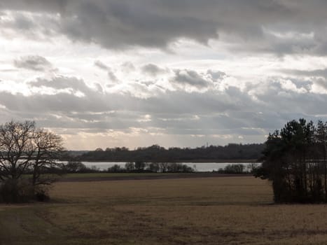 moody skyline clouds over autumn farm field ; essex; england; uk