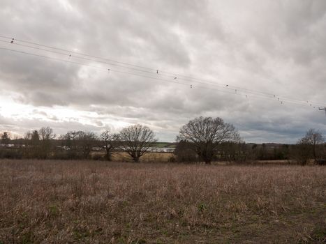 moody skyline clouds over autumn farm field ; essex; england; uk