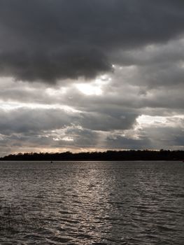 moody sky clouds autumn winter grey dark bay ocean river estuary; essex; england; uk